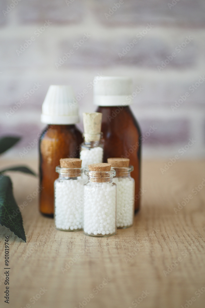 Homeopathic pills containers on a table Homeopathic pills containers on a table
