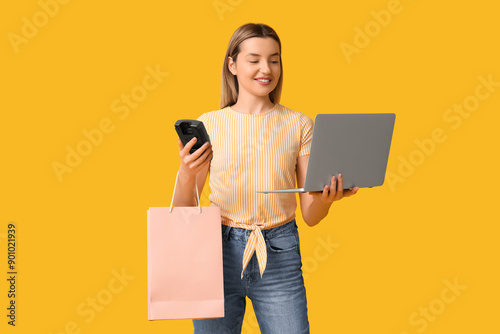 Young woman with laptop and...