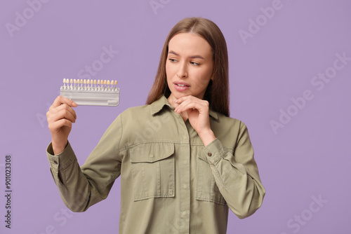 Thoughtful young woman with...