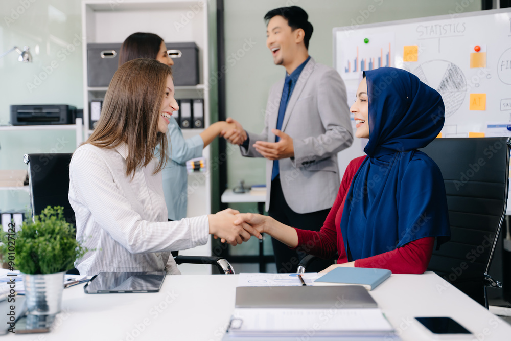 Fototapeta premium Two confident business man shaking hands during a meeting in the office, success, dealing, greeting and partner]