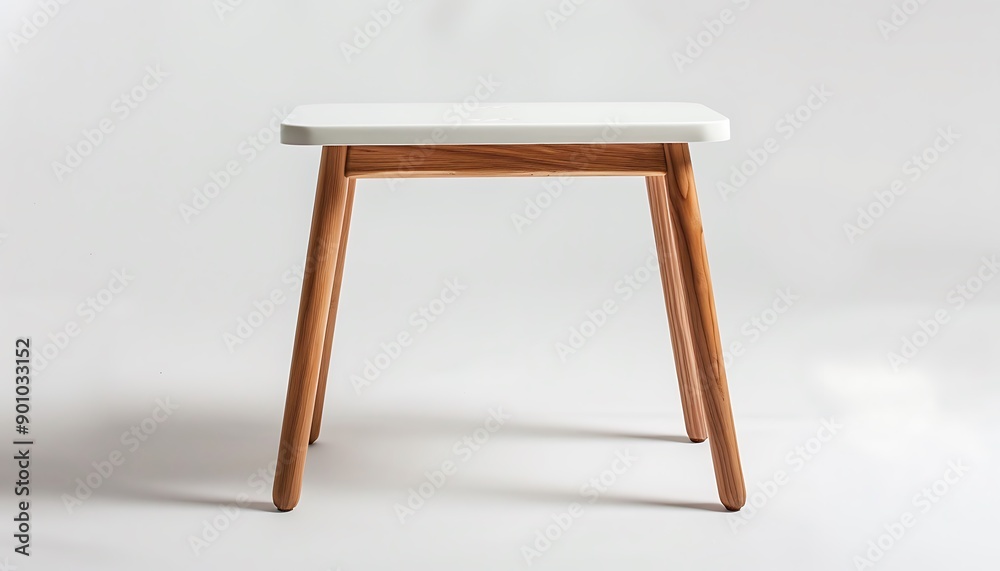 A compact Scandinavian-style side table with a white top and wooden legs placed against a white background The clean lines and functional design are perfect for modern interiors A compact Scandinavian-style side table with a white top and wooden legs placed against a white background The clean lines and functional design are perfect for modern interiors