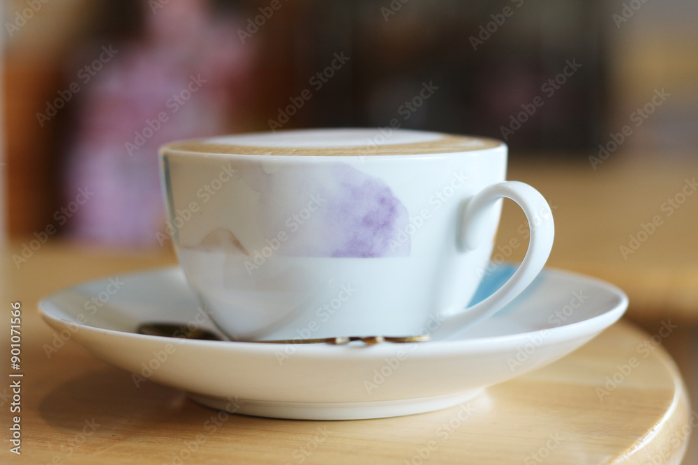 Hot latte coffee cup on table in coffee shop Hot latte coffee cup on table in coffee shop