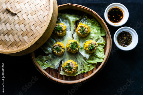 Canvas Print steaming Chicken Sui Mai served in bamboo steamer isolated background top view o