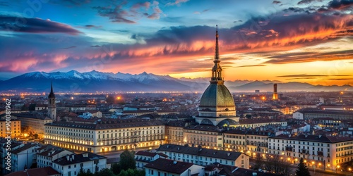 Cityscape of Torino (Turin Italy) at dusk with colorful moody sky The Mole Antonelliana towering on the illuminated city below A