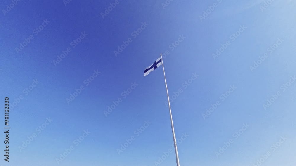 Flag of Finland on a gentle wind against a blue summer sky Flag of Finland on a gentle wind against a blue summer sky