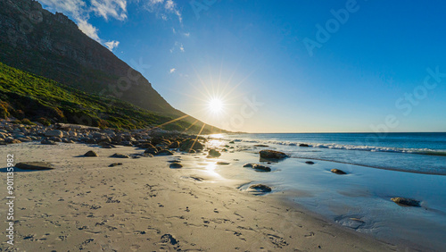 Scenic sunset at Sandy Bay Beach near Llandudno, Cape Town, South Africa photo