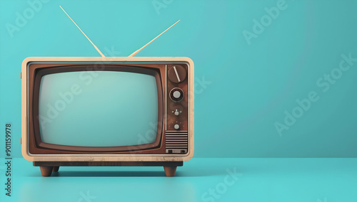 Vintage retro television set with antennas against a blue background. Perfect for nostalgic themes and media industry concepts.