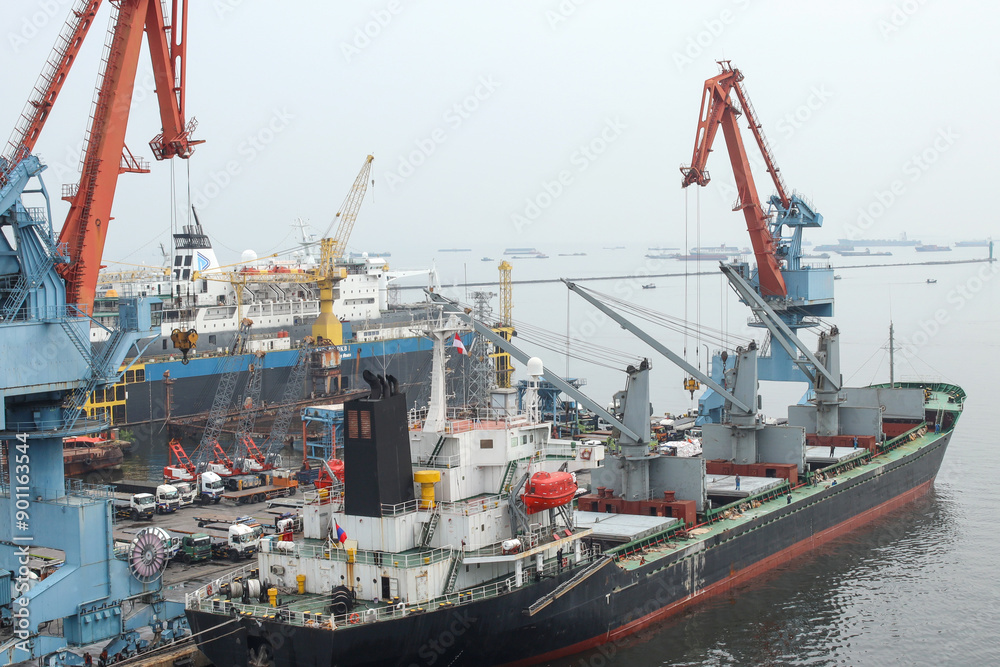 Container Ship Docked In The Port For Loading And Unloading Containers Container Ship Docked In The Port For Loading And Unloading Containers