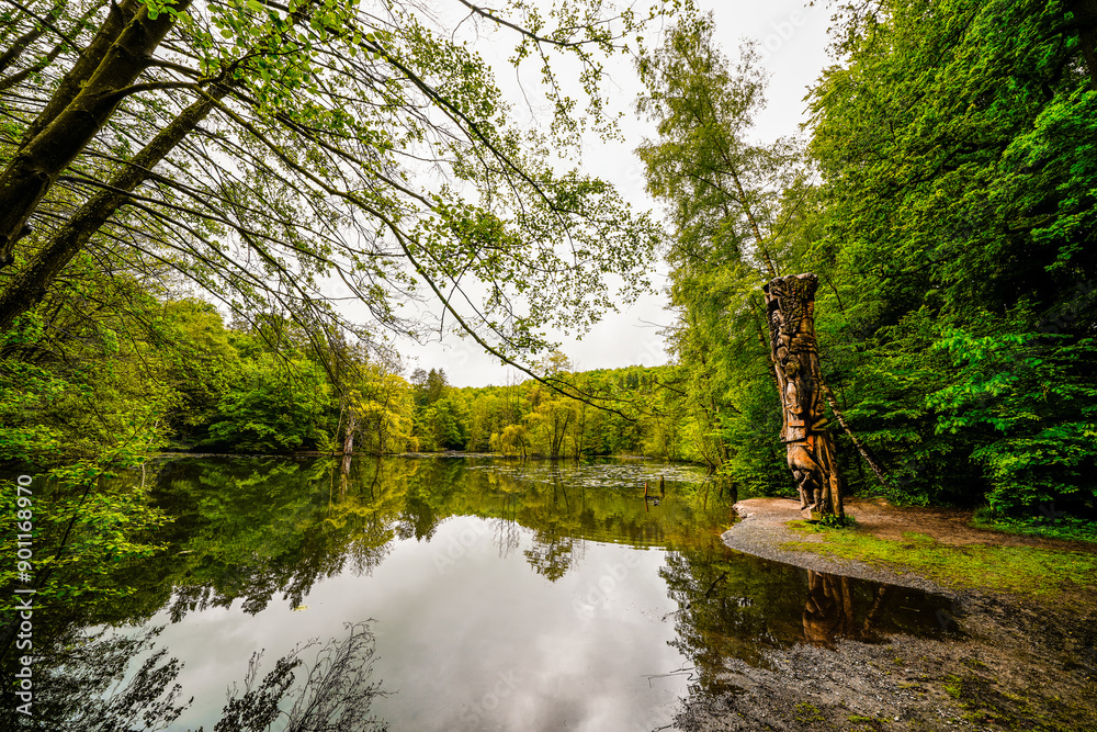 Fototapeta premium Hexenteich near Menden. Idyllic small pond with green nature in the Sauerland.