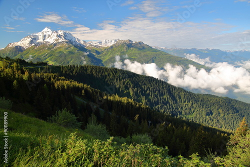 Obraz na płótnie La Rosiere (Ski resort) overlooking the valley towards Bourg Saint Maurice, Northern French Alps, Savoie, France, with mountain peaks (Mont Pourri) and morning clouds w salonie