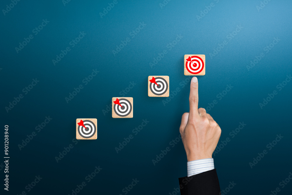 Ladder of success in business growth concept with target icon on wooden cubes Ladder of success in business growth concept with target icon on wooden cubes