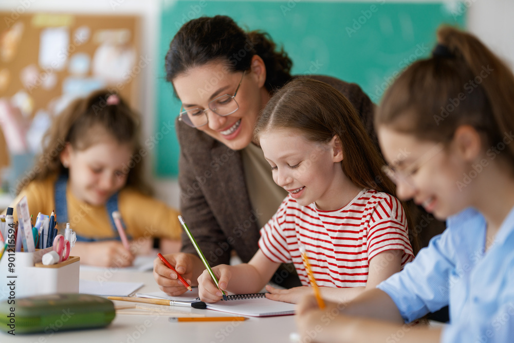 Fototapeta premium Happy kids and teacher at school