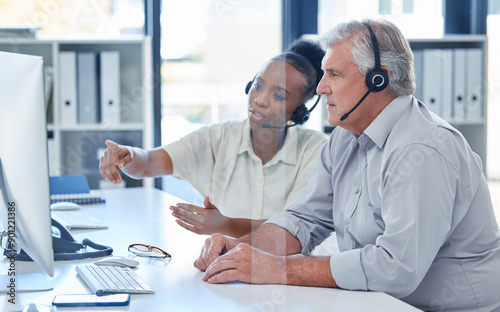 Teamwork, business people and pointing on computer in call center, research and customer enquiry with help. Collaboration, man and woman for coworking on monitor, solution and telemarketing in office