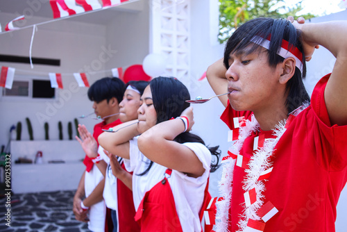 Young Asians Marbles Race Participants Ready to Line Up at the Starting Line. Commemorate Indonesian Independence Day, August 17. photo