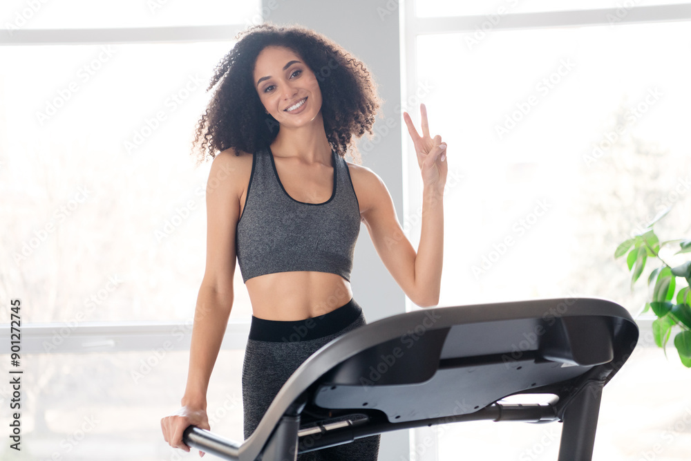Φωτογραφία Photo of lovely adorable active girl coach running physical exercises in gym v-s