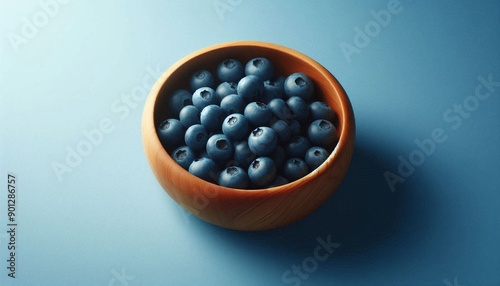 Fresh Blueberries in a Wooden Bowl on a Blue Background Close Up. Healthy Eating Concept. Healthy, Organic, Natural, Minimalist, Freshness, Top View.