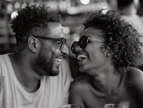 A couple's affectionate moment captured in a simple yet powerful black and white photo photo