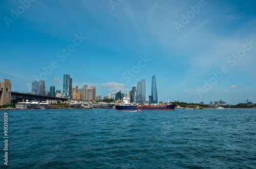 Scenic view of sea and buildings against sky,Blues Point Reserve