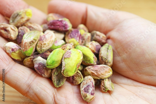 Heap of Pistachios in Hand, Delicious Nuts Packed with Antioxidants and Low in Calories
