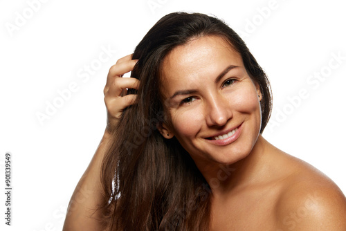 Wallpaper Mural Close up photo of beautiful woman with long, brunette hair posing looking at camera against white studio background. Concept of beauty, haircare treatments and cosmetology products, hairstyle, Torontodigital.ca