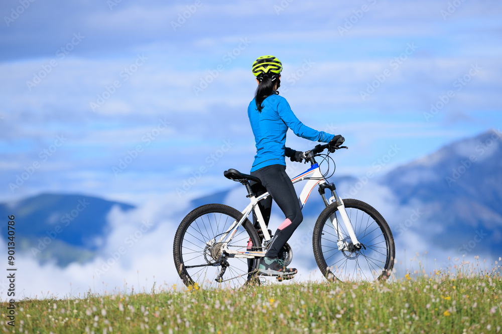 Riding mountain bike on beautiful mountain top Riding mountain bike on beautiful mountain top