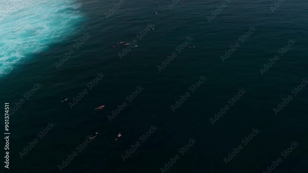 Drone rises above surfers paddling out in lineup at Cloudbreak Fiji Drone rises above surfers paddling out in lineup at Cloudbreak Fiji