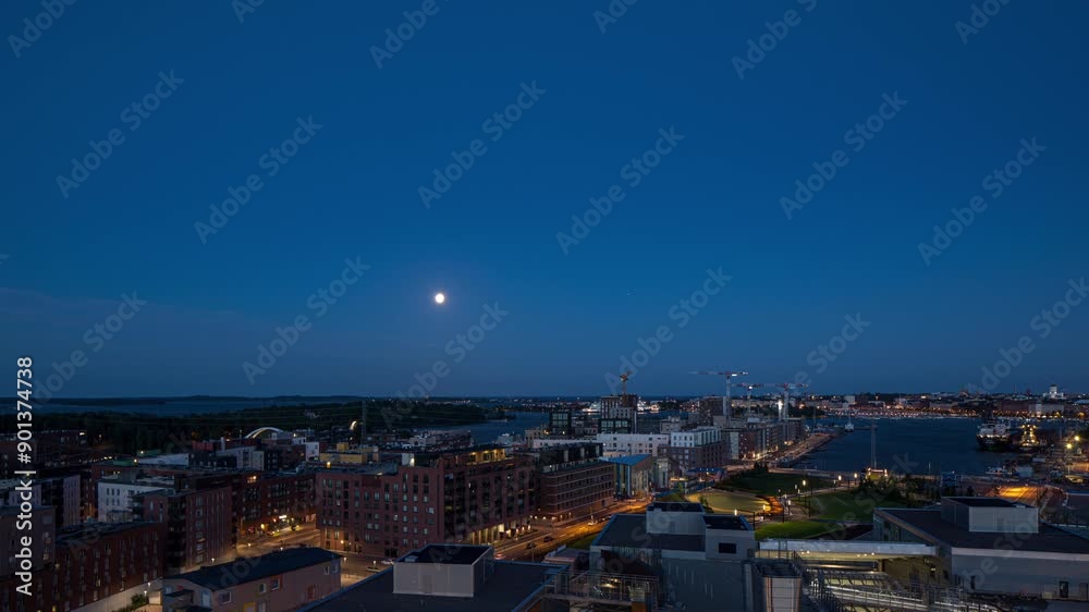 Timelapse of the moon rising over the cityscape of Helsinki, summer night in Finland Timelapse of the moon rising over the cityscape of Helsinki, summer night in Finland