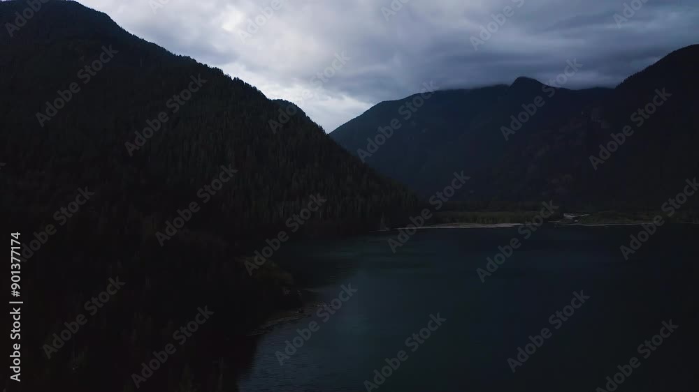 Silhouette of mountain and forest at blue hour along treeline edge, aerial dolly Silhouette of mountain and forest at blue hour along treeline edge, aerial dolly