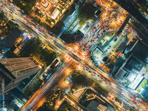 Expressway top view, Road traffic an important infrastructure, Drone aerial view. Aerial top view of a illuminated multilevel junction ring road motorway interchange with car traffic. Bangkok. 