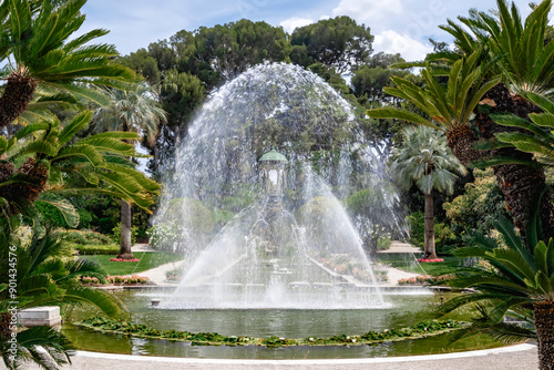 A beautiful garden fountain of Villa Ephrussi de Rothschild in a sunny day photo