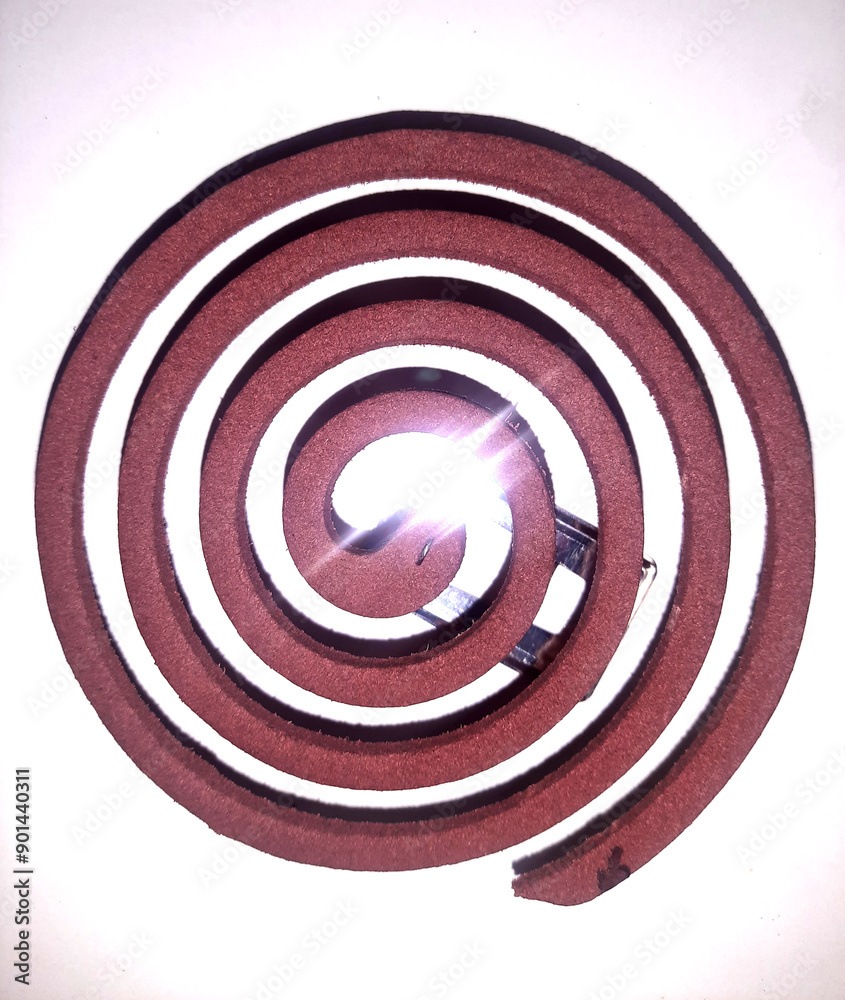 Red mosquito coil isolated on white background. Red mosquito coil isolated on white background.