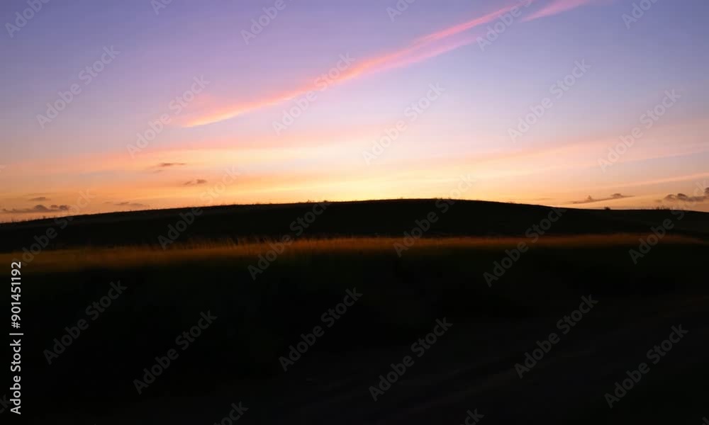Sunset over a field of grass Sunset over a field of grass