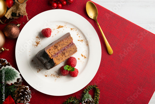Delicious original sacher chocolate cake from an overhead perspective. Table with Christmas decoration.