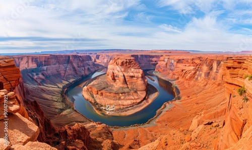 panoramic view of horseshoe bend, arizona, with blue sky and clouds, colorado river winding through red rock canyon.