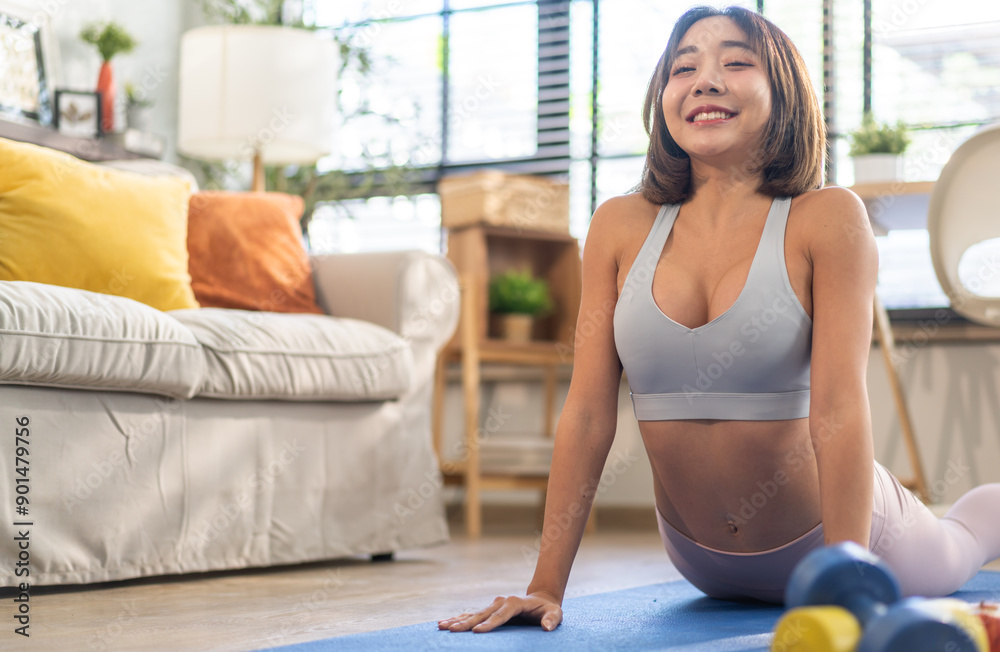 Portrait of sport slim fit strength asian woman training in sportswear sitting relax and practicing yoga, fitness, exercise, wellness, workout, sport at home.Diet concept.Fitness and healthy lifestyle Portrait of sport slim fit strength asian woman training in sportswear sitting relax and practicing yoga, fitness, exercise, wellness, workout, sport at home.Diet concept.Fitness and healthy lifestyle