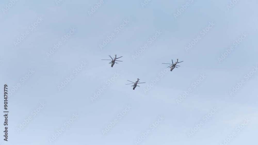Battle helicopters fly away - bottom view from the ground Battle helicopters fly away - bottom view from the ground