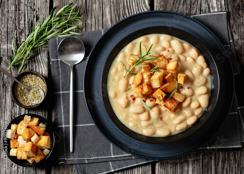 rosemary garlic creamy white bean soup in bowl