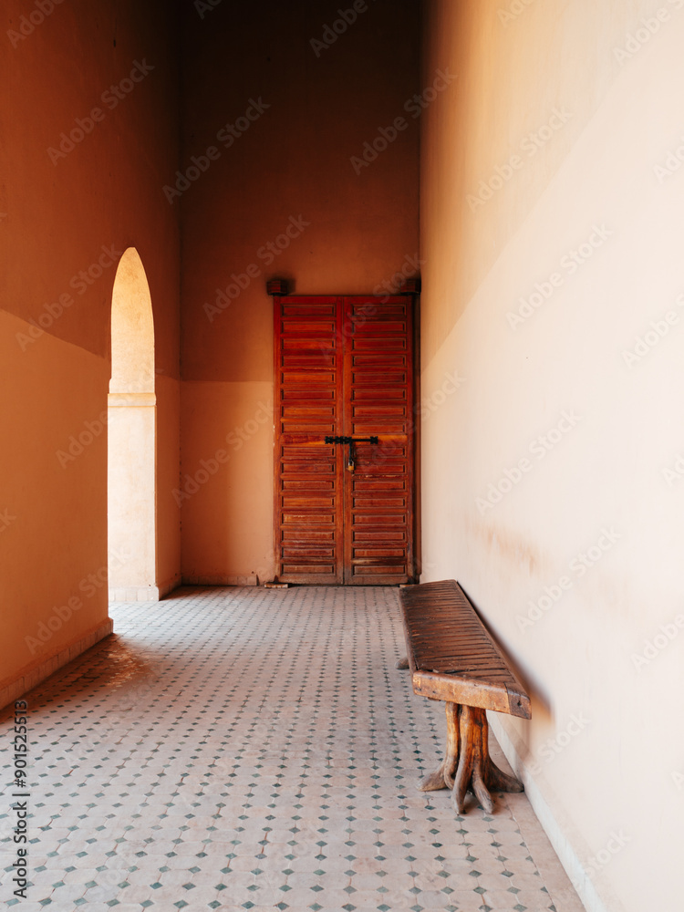 Rustic Wooden Door in Sunlit Corridor with Bench Rustic Wooden Door in Sunlit Corridor with Bench