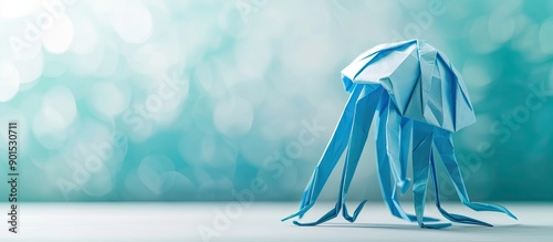 A cute jellyfish origami isolated on a white background with a copy space image perfect as a simple craft for kids to start with