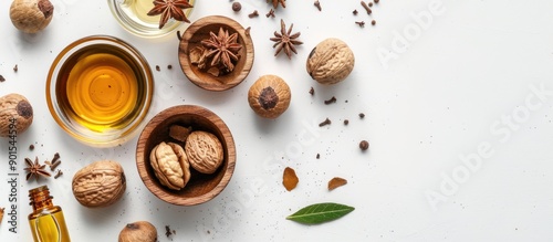 Overhead view on white backdrop showcasing nutmeg oil for aromatherapy, ample copy space image for text or design.