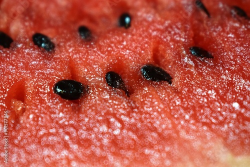 Summer refreshing background - juicy ripe watermelon with seeds close-up
