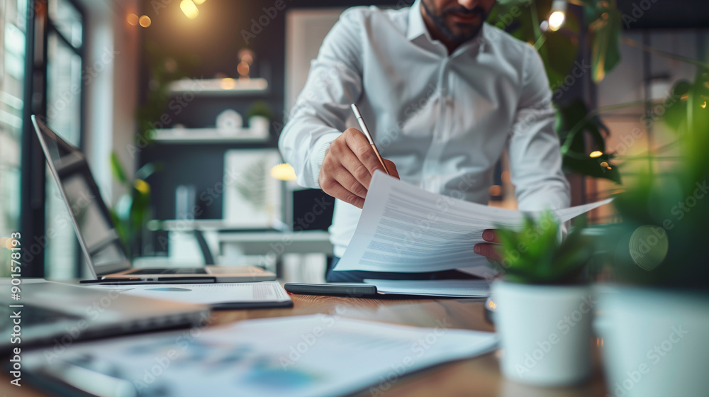Modern office scene: close-up of team members focused on reviewing documents in a well-organized workspace.
Modern office scene: close-up of team members focused on reviewing documents in a well-organized workspace.