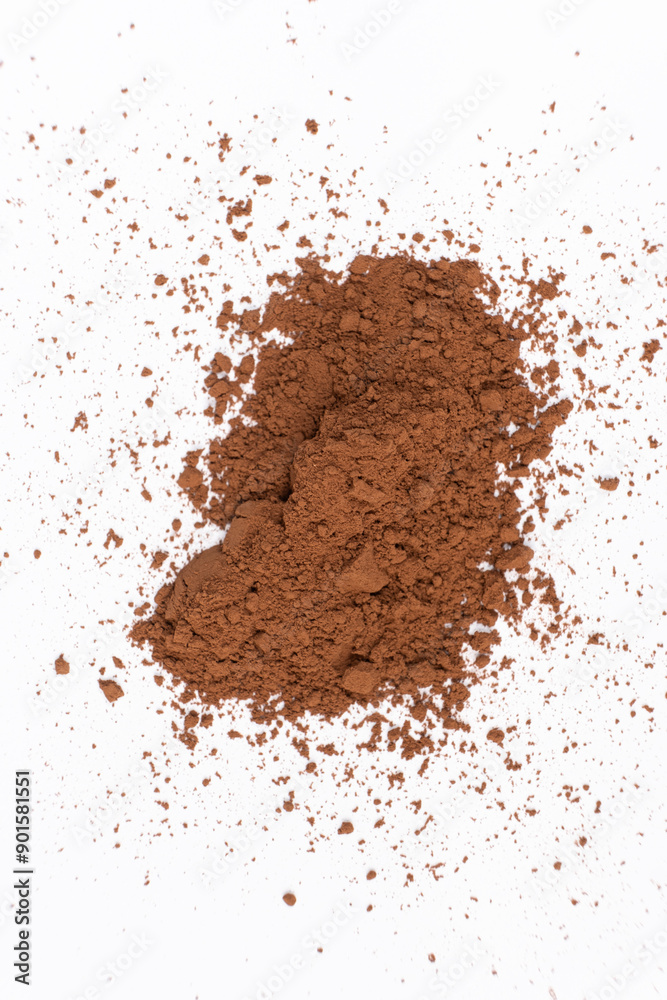 Cocoa powder scattered on white background close-up Cocoa powder scattered on white background close-up