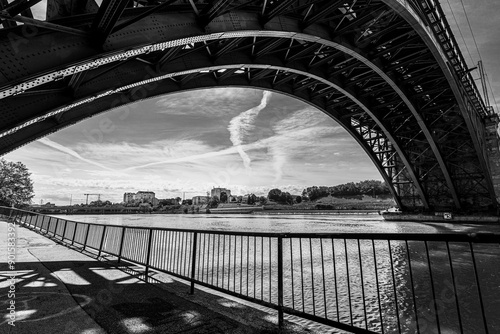 A view of the city Maribor and the train bridge with buildings in the background. A cloudy sky photo