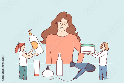 Woman chooses hair styling method while standing near table with shampoos and creams or hair dryer. Little cosmetologists advertise own products for skin care and creating fashionable hairstyles