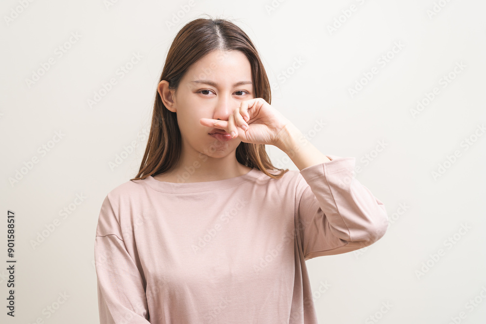 Bad smelling, deodorant asian young woman hand squeeze, covering nose smell stink, breathing smelly disgust strong, expression face dislike odor, smelly armpit underarm. Medical health, skin body care Bad smelling, deodorant asian young woman hand squeeze, covering nose smell stink, breathing smelly disgust strong, expression face dislike odor, smelly armpit underarm. Medical health, skin body care