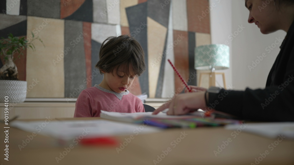 Parent guiding child through homework with a pencil, emphasizing the role of parental involvement in education, and the supportive home environment for learning Parent guiding child through homework with a pencil, emphasizing the role of parental involvement in education, and the supportive home environment for learning