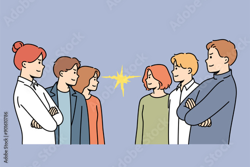 Groups of competing office workers look at each other demonstrating courage and readiness to fight. Competing business men and women seeking to demonstrate superiority over colleagues