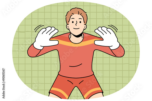Man football goalkeeper of getting ready to take kick from players from opposing team. Guy is professional football player participating in premier league or prestigious olympic tournament