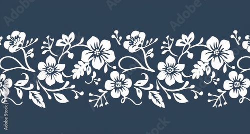 Elegant White Floral Border on Dark Blue Background, Ornamental Design for Fabric and Decoration ,Stenciled floral border in white on navy blue, featuring a variety of flowers and leaves.